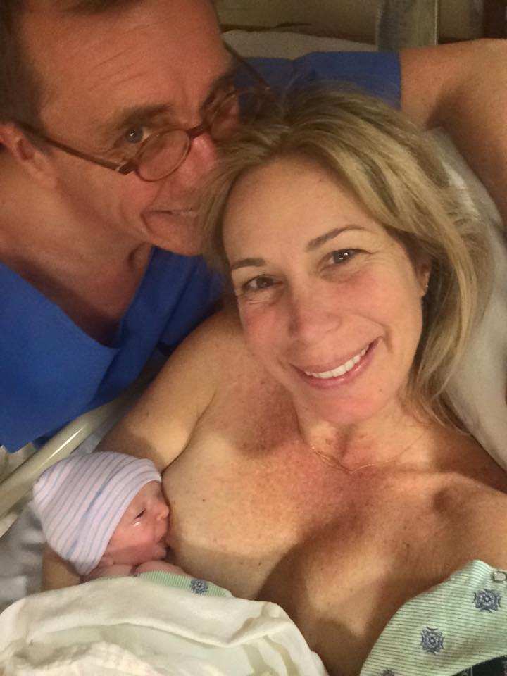 Photo of explorer Dr Mireya Mayor holding and breastfeeding her newborn