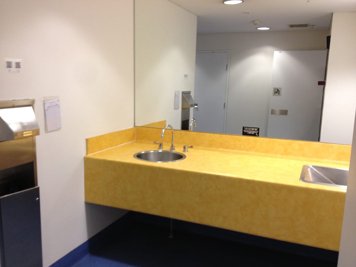 Photo of Sydney Airport parents room sink counter top changing table.