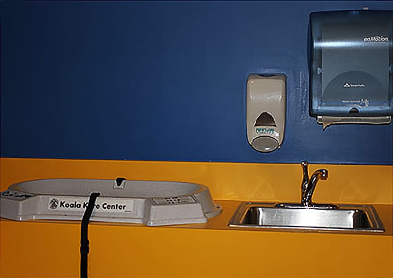 Photo of legoland california model mom babycare center changing table and sink.